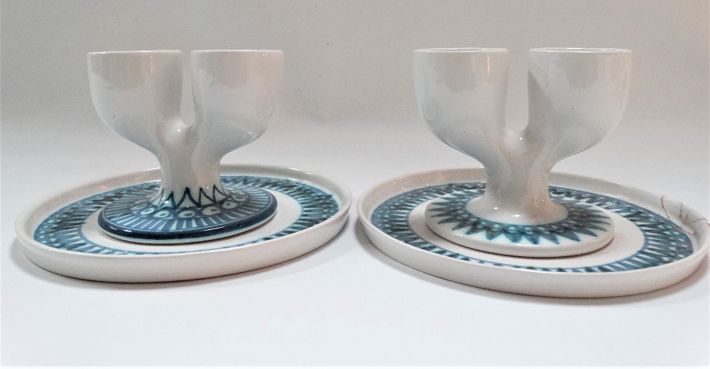 A pair of early Troika St Ives pottery double eggcups upon stands with underglaze blue zig zag