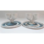 A pair of early Troika St Ives pottery double eggcups upon stands with underglaze blue zig zag