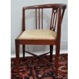 An Edwardian mahogany and inlaid corner chair.