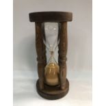 A modern replica of an hourglass in 18th century style.