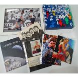 A collection of various autographs, including a black and white photograph of The Beatles with
