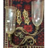 A pair of late 19th century brass lacquered foliate scroll wall sconces with glass trumpet shades,