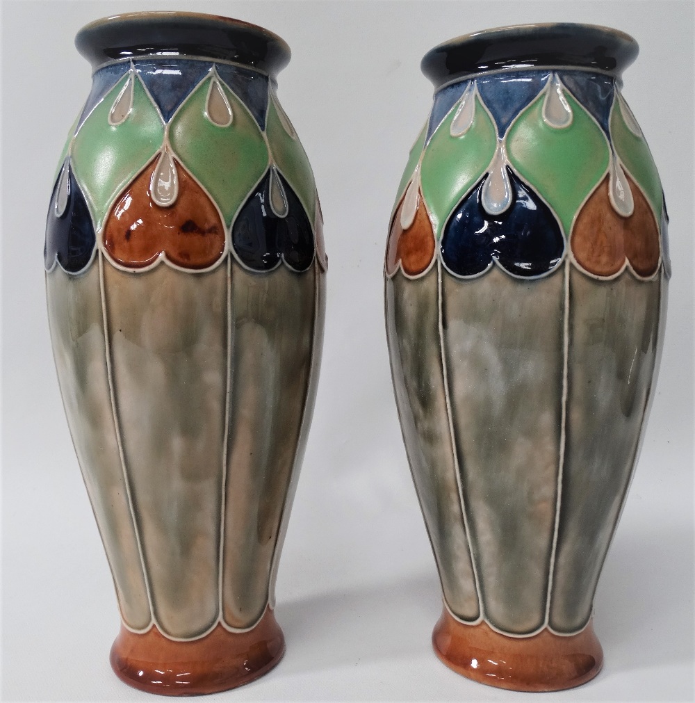 A pair of Royal Doulton stoneware vases with tubelined decoration, No.7760E, height 24cm.