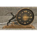A Dutch gilt brass mantle clock by AWU in mid 20th century style decorated with a leaping gazelle.