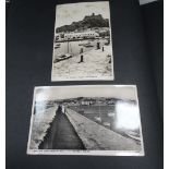 Two postcard albums containing Cornwall topographical, all of St Michaels Mount, early 20th