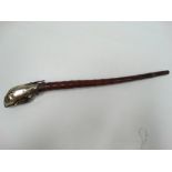 An oriental bamboo white metal and copper mounted opium pipe, length 36cm.