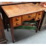 A George III mahogany and crossbanded kneehole writing table fitted three drawers above square