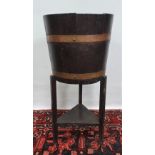 An oak and brass jardiniere on stand, unmarked.