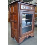 An Edwardian walnut and glazed music cabinet, width 68cm.