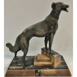 An Art Deco spelter figure of a greyhound on a stepped marble base, height 40cm, width 37cm.