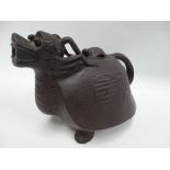 A large 20th century Chinese Yixing teapot, modelled as a mythical creature, the body with archaic