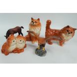 Five Beswick pottery animal figures, including three cats, an eagle and a matt glazed foal.