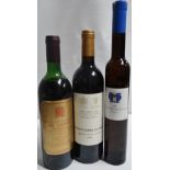 A bottle of House of Commons No.1 claret bordeaux, together with two other bottles.