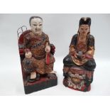 Two Chinese carved wood immortal figures, one gentleman sat on a throne his feet resting on a