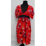 A Whistles red silk dress with floral decoration, size 12, length 92cm.