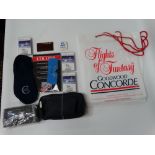 Concorde Goodwood related items, together with a BA toilet bag and Concorde slippers.