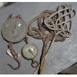 A Salter 200lb brass and iron hanging scales, another Salter balance scale and two carpet beaters.