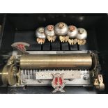 A Swiss music box with 9.25 inch cylinder playing twelve aires and with bees striking on five bells,