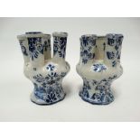 A matched pair of 19th century Dutch blue and white Delft six section tulip vases, both