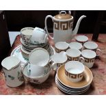 A Susie Cooper coffee set in 'Keystone' pattern, Old Gold C2134, comprising a coffee pot, milk