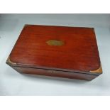 A 19th century mahogany brass bound writing slope with baize lined partially fitted interior and