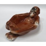 A novelty Sitzendorf porcelain nut dish in the form of a monkey, blue underglaze mark to the base