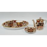 A modern Royal Crown Derby 'Imari' pattern miniature batchelor tea set, pattern No.1128, width of
