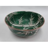 A Chinese green ground bamboo decorated bowl, red painted seal mark to the base, diameter 18cm.