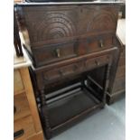 An 18th century oak bible box on stand, the hinged lid over an arcaded carved frieze with two