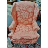 An early George III style wing armchair with hardwood cabriole legs.