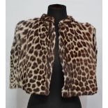 A ladies leopard fur cape.