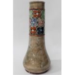 A Royal Doulton stoneware bottle vase, the neck tubeline decorated with a band of daisy heads upon a