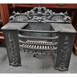 An early 19th century cast iron fire grate, width 66cm.