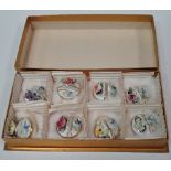 A set of eight modern Royal Crown Derby porcelain posy menu holders.