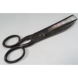 A large pair of 19th century steel scissors, stamped 'Buck Cheltenham ? Road', length 32cm.
