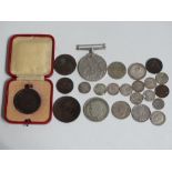 A collection of British and foreign coinage, including silver and an American 1853 half dime, a 1915