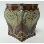 A Royal Doulton stoneware square section jardiniere, each side with stylised foliate relief modelled