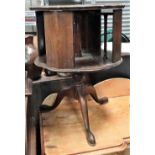 A George III style mahogany pedestal rotating bookcase on three outswept feet, diameter 50cm.
