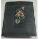 An early 20th century postcard album containing photographic portraits, topographical including