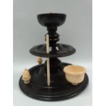 A Georgian turned ebony and ivory sewing stand, height 17cm (AF).