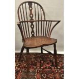 A 19th century elm and fruitwood Windsor armchair with bow back and H stretcher.