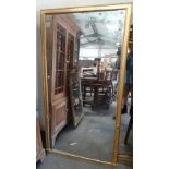 A 19th century gilt framed console mirror with plain moulded frame, marked for Frooms Looking
