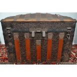 A late 19th century tin and wood framed travelling trunk.