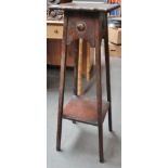 An early 20th century oak plant stand of tapering form.