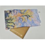 A silk scarf printed with a landscape for The Metropolitan Museum of Art, within original card box.