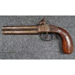 A 19th century double barreled over and under percussion hammer action pistol, with 5 inch barrels