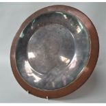 A Georg Jensen design copper and silvered dish, stamped 'GEORG JENSEN DESIGN', diameter 35cm.