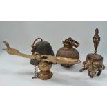 A collection of eastern brass wares, including an incense burner, an ovoid swing handled pot, two