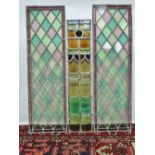 Three stained glass leaded panels, a pair measures 24 x 32cm, the smallest measures 22 x 20cm (3).