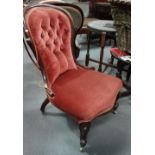 A Victorian mahogany framed and upholstered occasional chair with cabriole legs and button back.